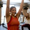 Fitness instructor working out with participants and using the EVO cableless headset mic